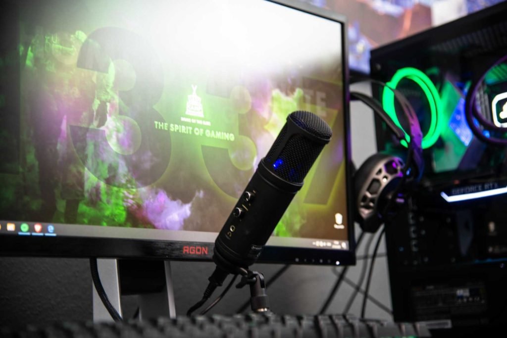 A gaming set with a mic, monitor and headphones