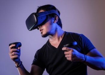 A guy playing a virtual reality game