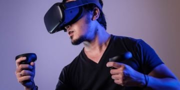 A guy playing a virtual reality game