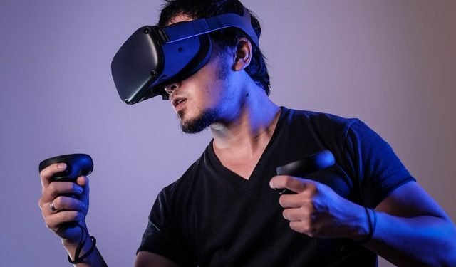 A guy playing a virtual reality game
